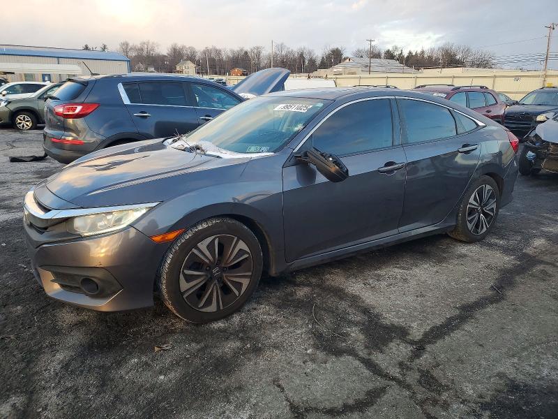 HONDA CIVIC EXL 2016 with VIN 2HGFC1F71GH656954 - Photo from auction