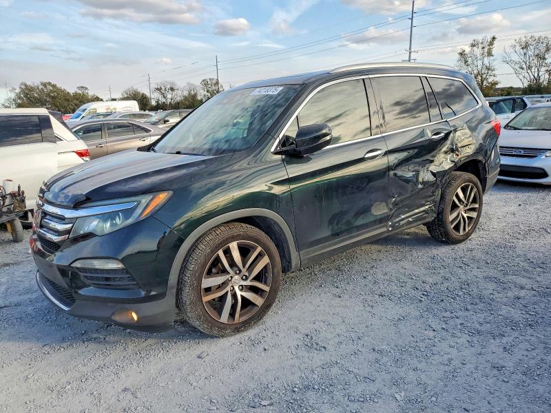 HONDA PILOT 2017 with VIN 5FNYF5H95HB002809 - Photo from auction