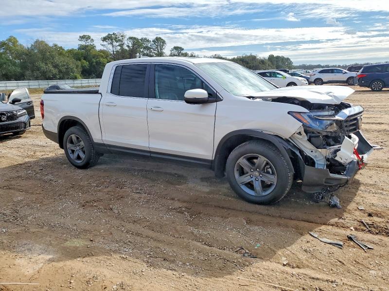Photo 4 from auction – 2023 HONDA RIDGELINE with VIN 5FPYK3F50PB032788