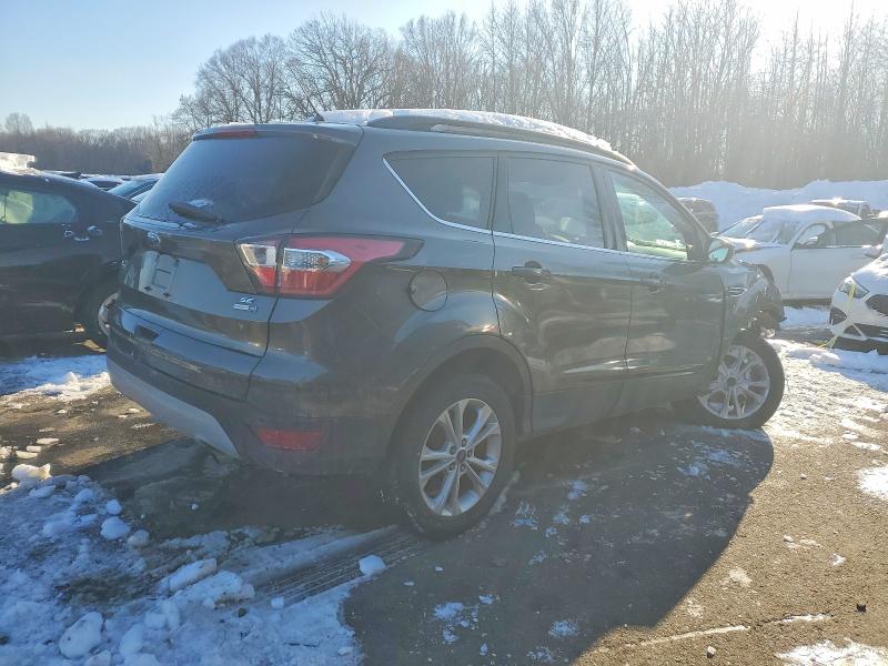 Photo 3 from auction – 2017 FORD ESCAPE with VIN 1FMCU9GD6HUA38007