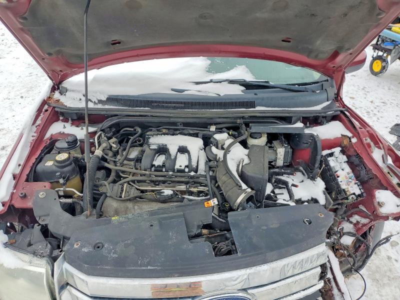 Photo 12 from auction – 2008 FORD TAURUS X E with VIN 1FMDK07W38GA37239