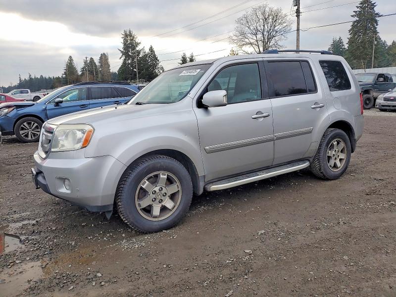 HONDA PILOT TOUR 2011 with VIN 5FNYF3H90BB013616 - Photo from auction