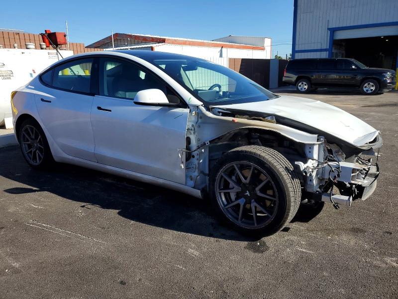Photo 4 from auction – 2022 TESLA MODEL 3 with VIN 5YJ3E1EA4NF115229