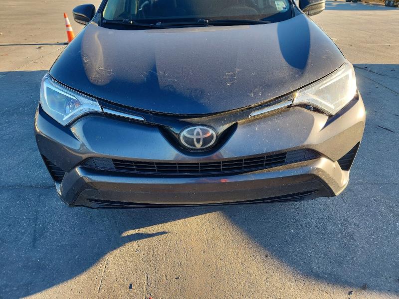 Photo 12 from auction – 2018 TOYOTA RAV4 LE with VIN JTMZFREV2JJ201778