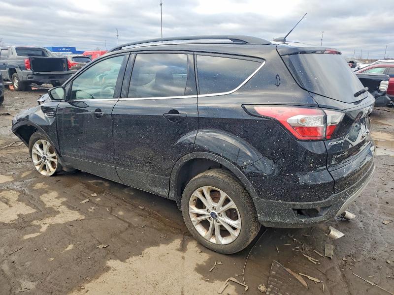 Photo 2 from auction – 2018 FORD ESCAPE with VIN 1FMCU9GD6JUB38016