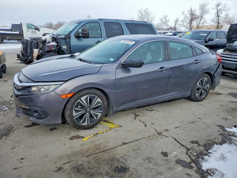 HONDA CIVIC EX 2018 with VIN 19XFC1F34JE000620 - Photo from auction