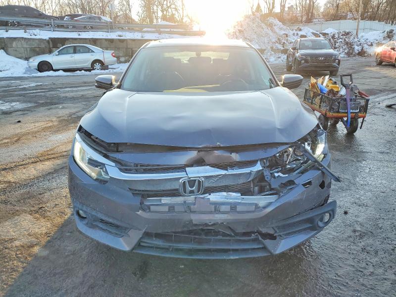 Photo 5 from auction – 2018 HONDA CIVIC EX with VIN 2HGFC1F3XJH641129