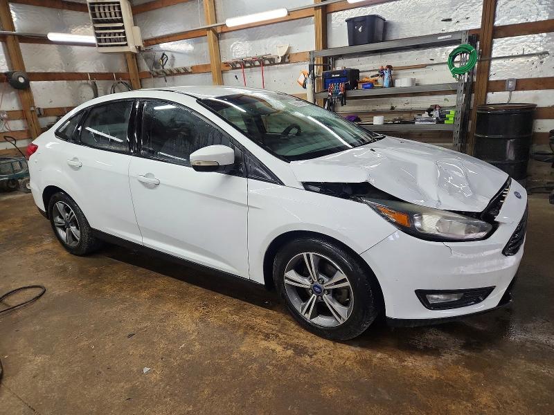 Photo 4 from auction – 2016 FORD FOCUS SE with VIN 1FADP3FE3GL403096