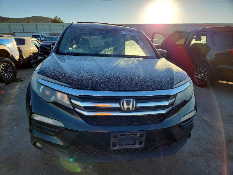Photo 5 from auction – 2016 HONDA PILOT EX with VIN 5FNYF6H42GB069974
