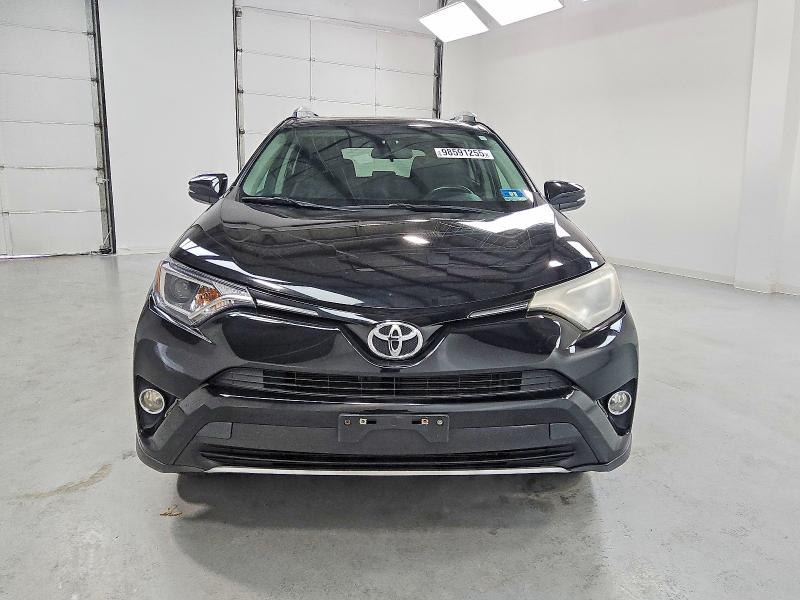 Photo 5 from auction – 2016 TOYOTA RAV4 XLE with VIN 2T3RFREV2GW455579