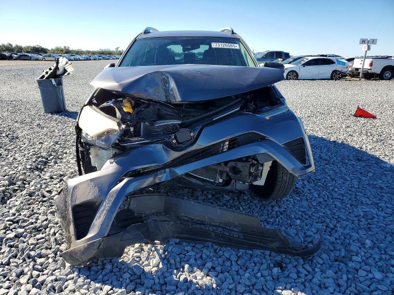 Photo 5 from auction – 2018 TOYOTA RAV4 with VIN JTMZFREV3JJ207458