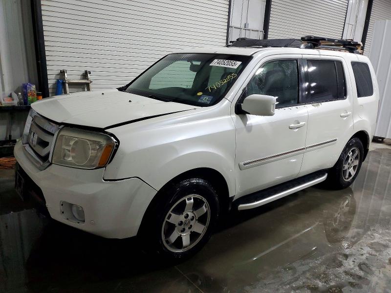 HONDA PILOT TOUR 2011 with VIN 5FNYF4H97BB017264 - Photo from auction