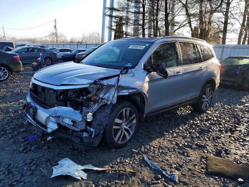 HONDA PILOT ELIT 2016 with VIN 5FNYF6H00GB125777 - Photo from auction
