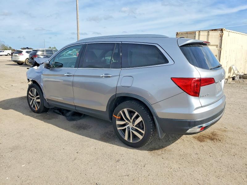 Photo 2 from auction – 2016 HONDA PILOT TOUR with VIN 5FNYF6H90GB126894