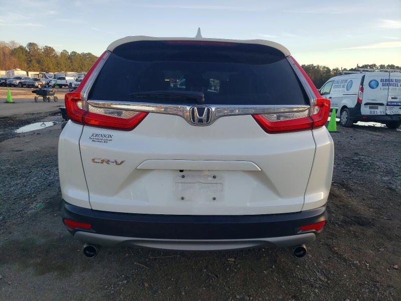 Photo 6 from auction – 2018 HONDA CR-V with VIN 5J6RW1H87JL012016