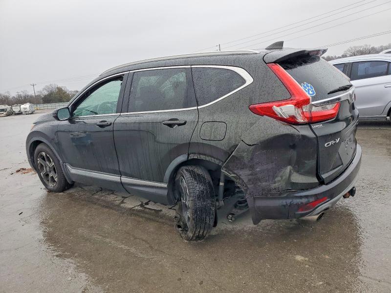 Photo 2 from auction – 2017 HONDA CR-V with VIN 7FARW1H97HE030581