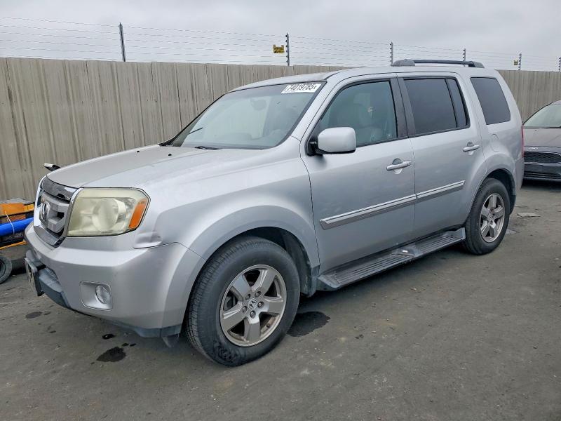 HONDA PILOT EXLN 2011 with VIN 5FNYF4H71BB020319 - Photo from auction