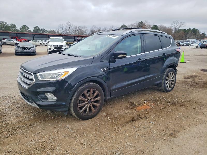 FORD ESCAPE TIT 2017 with VIN 1FMCU0J9XHUE34618 - Photo from auction