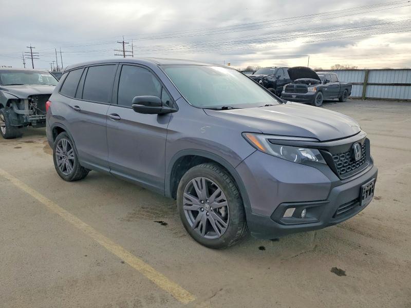 Photo 4 from auction – 2021 HONDA PASSPORT E with VIN 5FNYF8H55MB018257