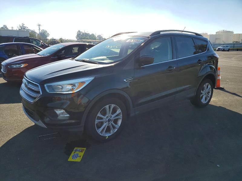 FORD ESCAPE SE 2018 with VIN 1FMCU0GD9JUB10495 - Photo from auction