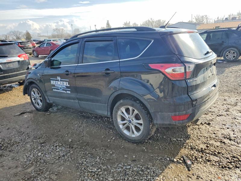 Photo 2 from auction – 2017 FORD ESCAPE SE with VIN 1FMCU9GD9HUB54091