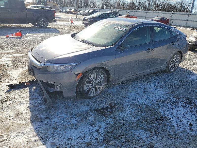 HONDA CIVIC EX 2018 with VIN JHMFC1F35JX000947 - Photo from auction