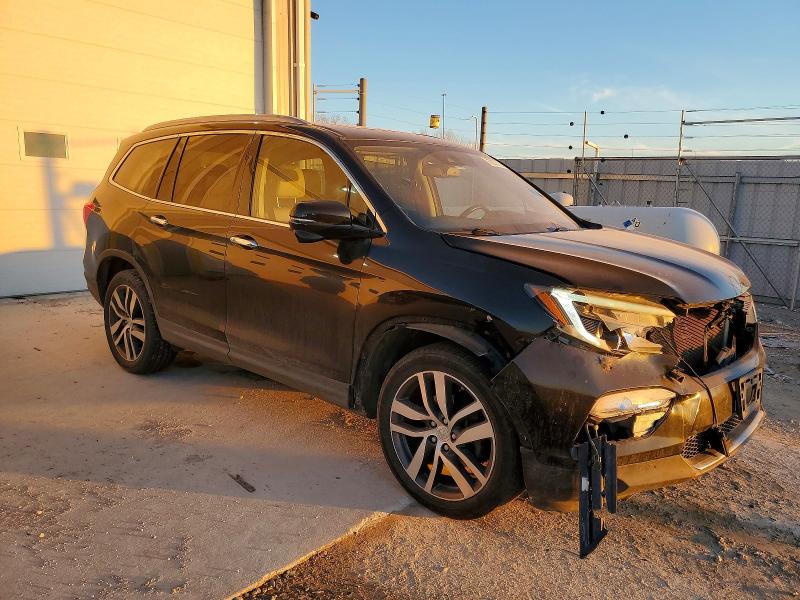 Photo 4 from auction – 2016 HONDA PILOT with VIN 5FNYF6H92GB003940
