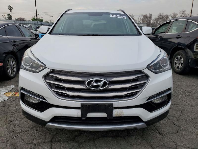 Photo 5 from auction – 2017 HYUNDAI SANTA FE S with VIN 5NMZU3LB7HH008473