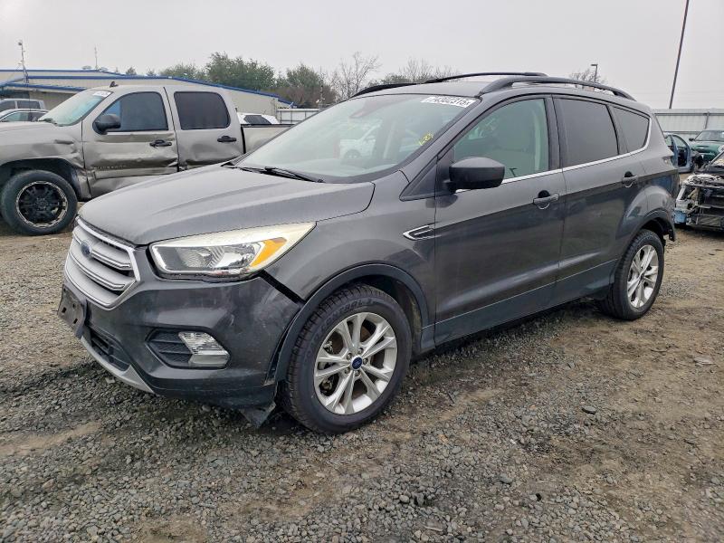FORD ESCAPE SE 2018 with VIN 1FMCU9GD2JUA87341 - Photo from auction