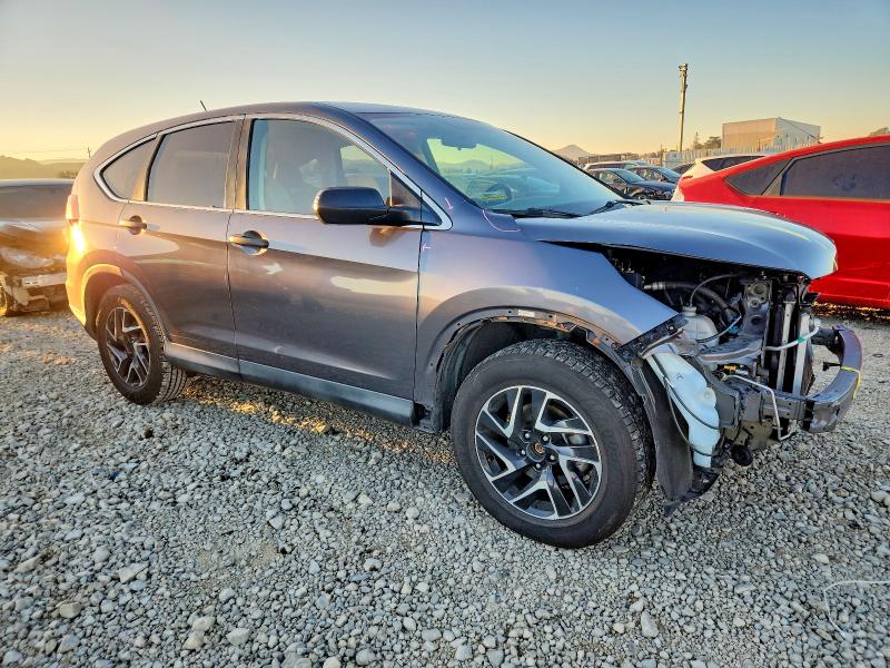 Photo 4 from auction – 2015 HONDA CR-V LX with VIN 2HKRM3H39FH559490