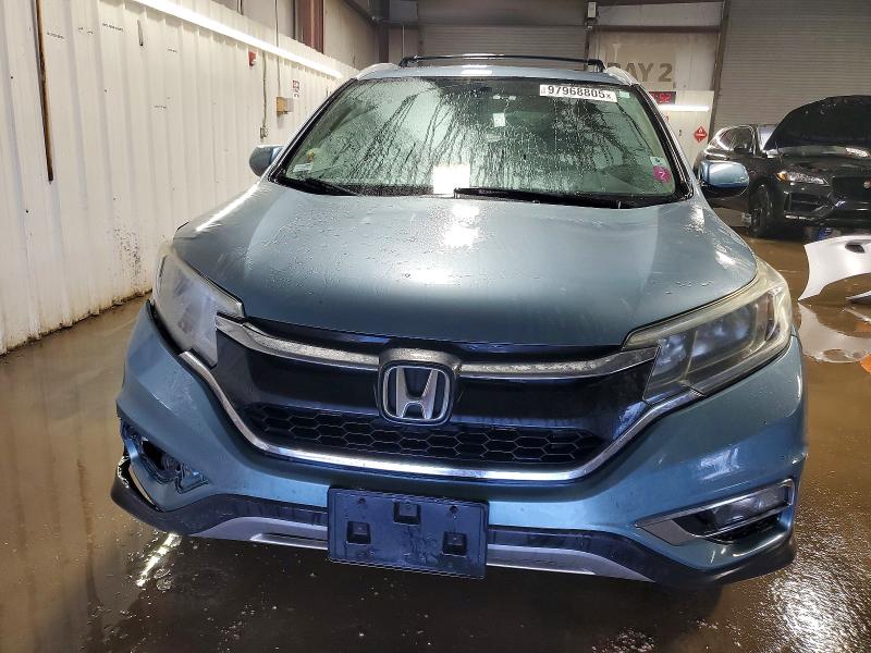 Photo 5 from auction – 2015 HONDA CR-V with VIN 2HKRM3H5XFH532641