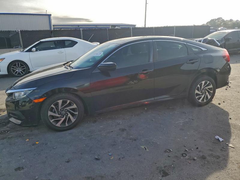 HONDA CIVIC EX 2017 with VIN 19XFC2F74HE063641 - Photo from auction