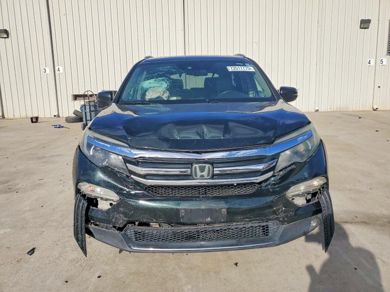 Photo 5 from auction – 2016 HONDA PILOT TOUR with VIN 5FNYF5H96GB043948