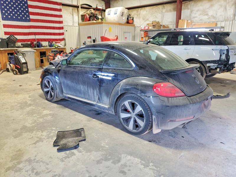 Photo 2 from auction – 2014 VOLKSWAGEN BEETLE TUR with VIN 3VW4T7AT7EM635535