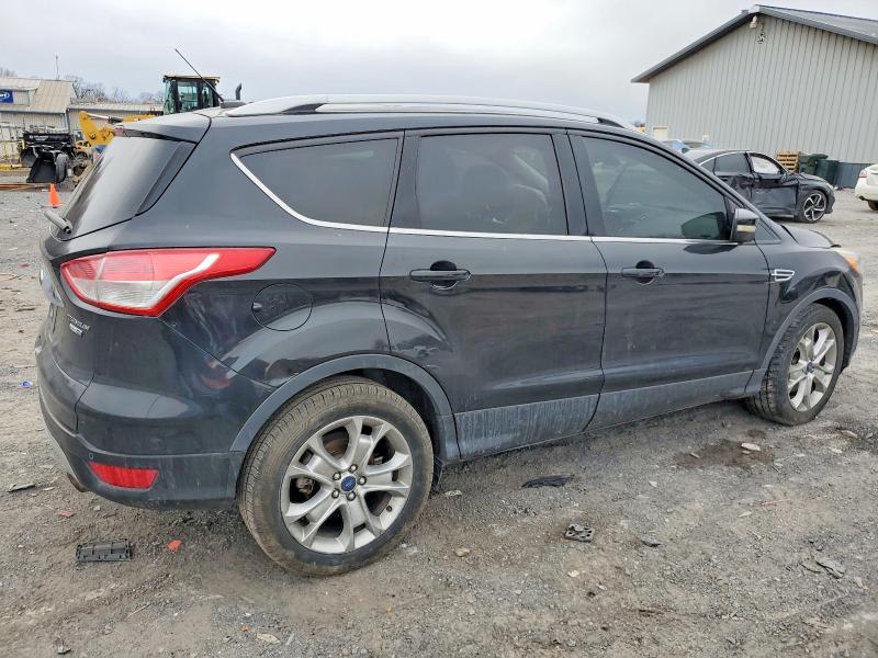 Photo 3 from auction – 2015 FORD ESCAPE TIT with VIN 1FMCU9J92FUA72575