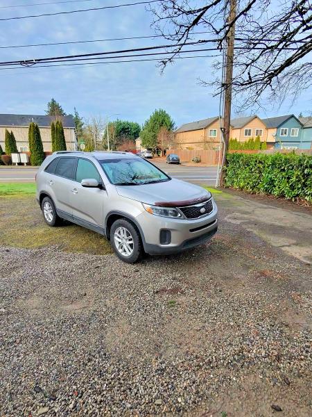 KIA SORENTO LX 2015 with VIN 5XYKTDA70FG583935 - Photo from auction