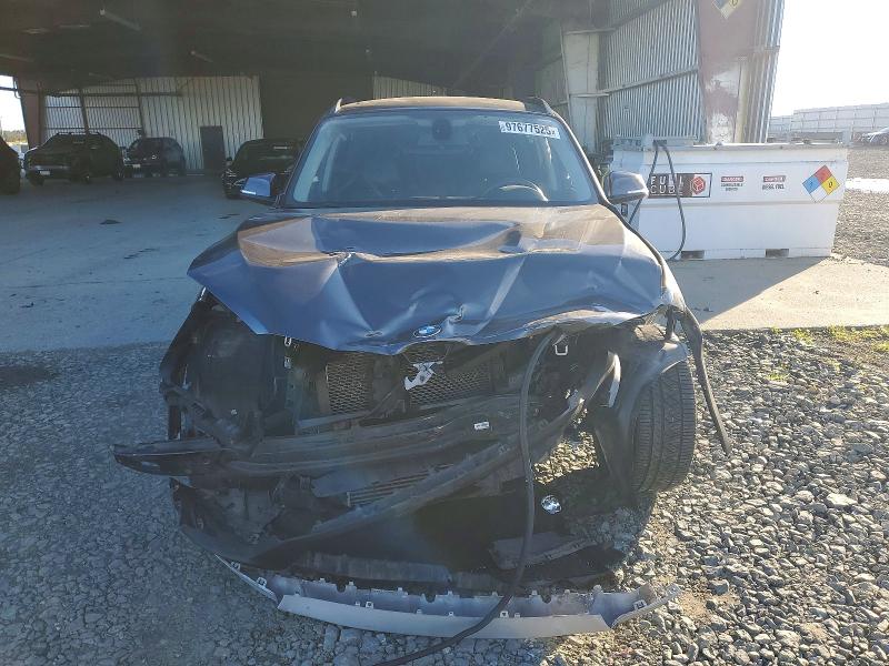Photo 5 from auction – 2015 BMW X1 SDRIVE2 with VIN WBAVM1C54FV319529