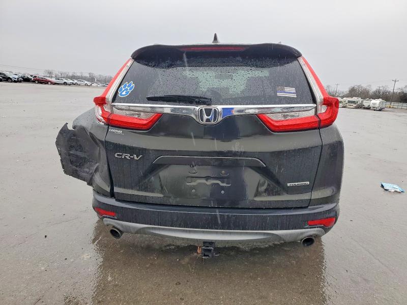 Photo 6 from auction – 2017 HONDA CR-V with VIN 7FARW1H97HE030581