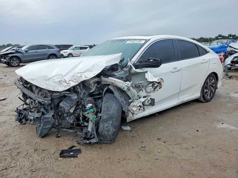 HONDA CIVIC EX 2018 with VIN 19XFC2F7XJE002803 - Photo from auction