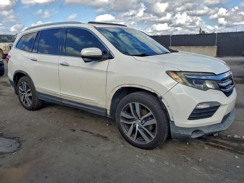 Photo 4 from auction – 2016 HONDA PILOT TOUR with VIN 5FNYF5H97GB022798