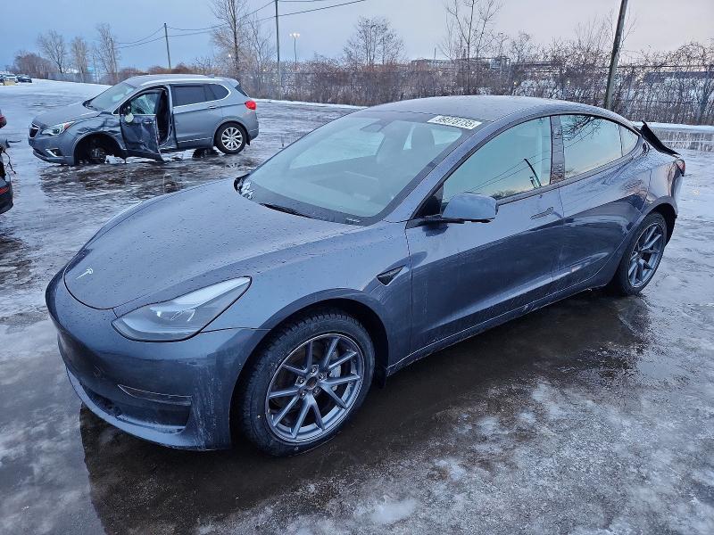 TESLA MODEL 3 2023 with VIN LRW3E1FA8PC900087 - Photo from auction