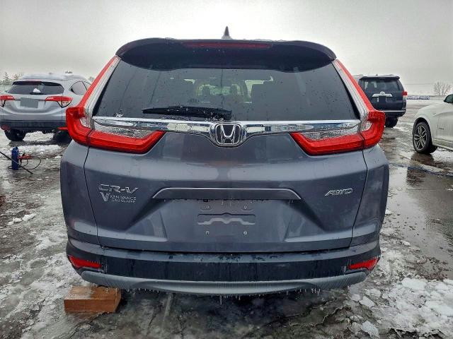 Photo 6 from auction – 2017 HONDA CR-V with VIN 5J6RW2H81HL023643