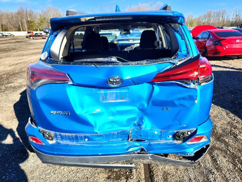 Photo 6 from auction – 2018 TOYOTA RAV4 with VIN JTMZFREV2JD115966