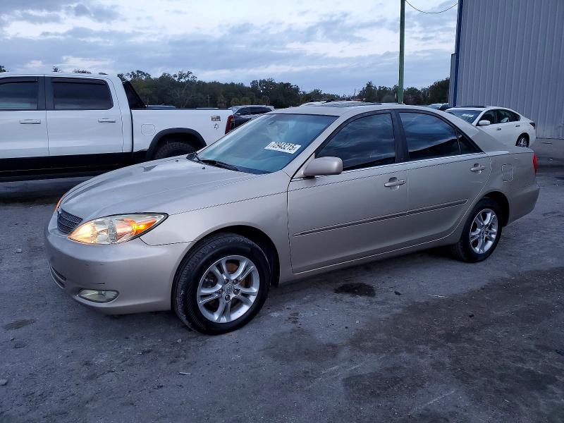 TOYOTA CAMRY LE 2004 with VIN 4T1BF32K94U067651 - Photo from auction