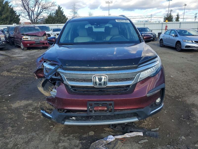 Photo 5 from auction – 2021 HONDA PILOT TOUR with VIN 5FNYF6H60MB036680