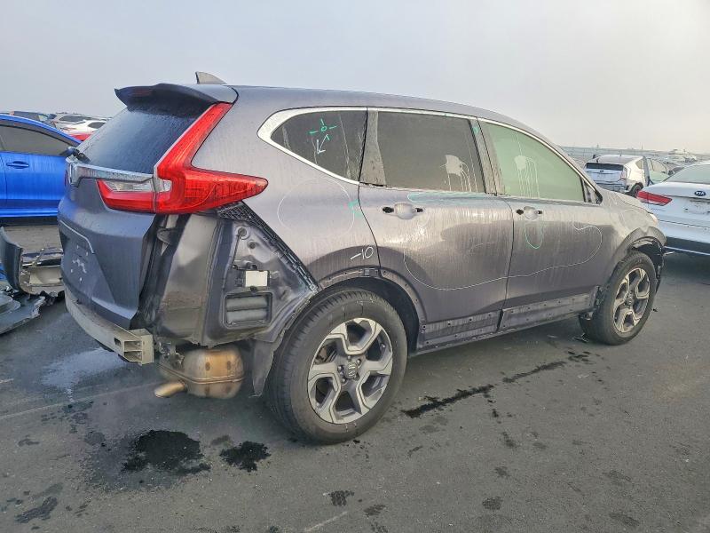 Photo 3 from auction – 2017 HONDA CR-V with VIN 7FARW1H57HE043263