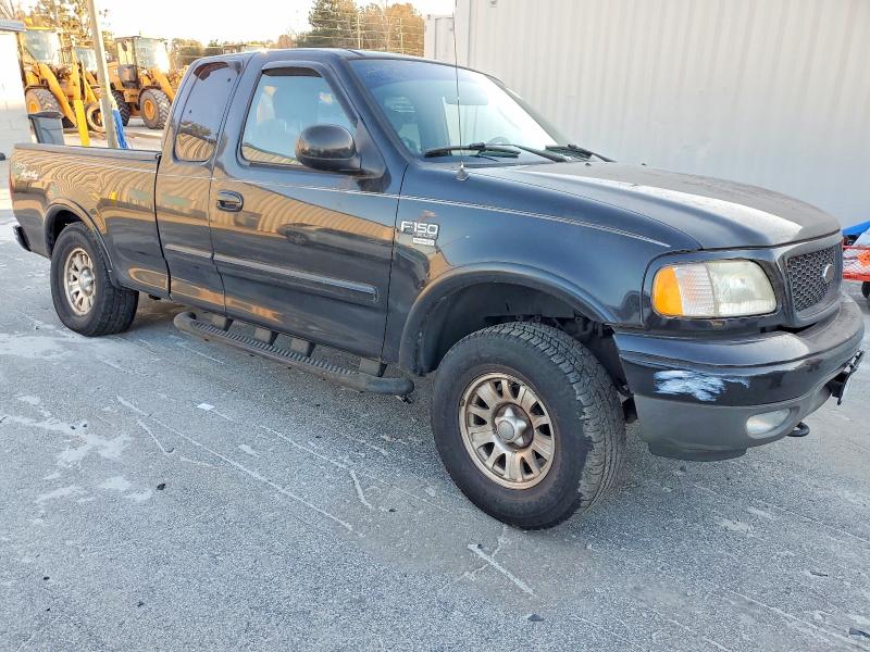 Photo 4 from auction – 2003 FORD F150 with VIN 1FTRX18L73NB66384