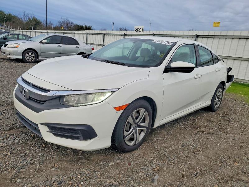 HONDA CIVIC LX 2018 with VIN 19XFC2F53JE202873 - Photo from auction