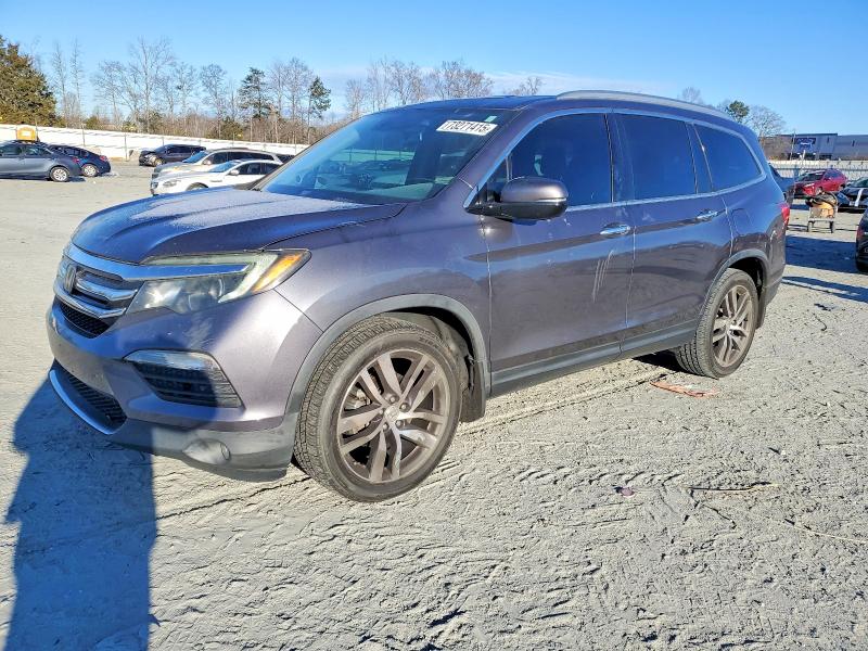 HONDA PILOT TOUR 2016 with VIN 5FNYF5H95GB034707 - Photo from auction