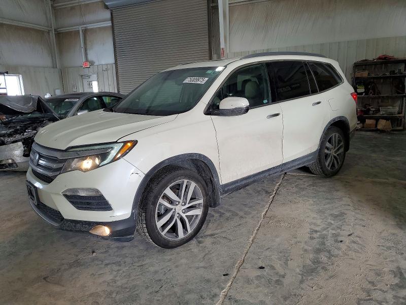 HONDA PILOT TOUR 2016 with VIN 5FNYF6H91GB031907 - Photo from auction